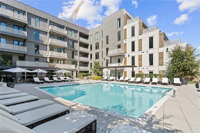 community pool featuring a patio area