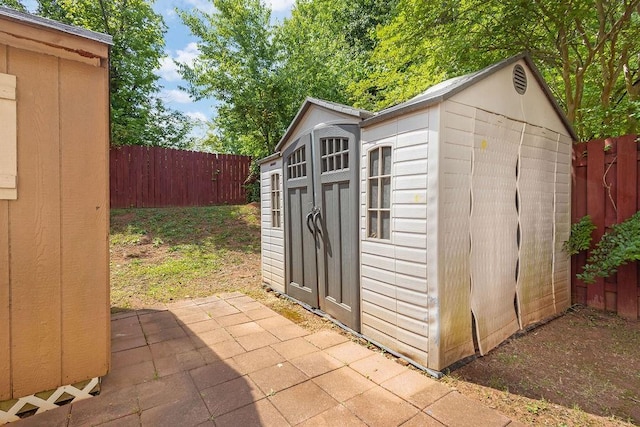 view of shed with a fenced backyard