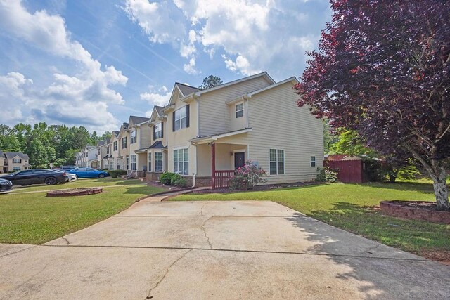view of front of house with a front lawn and a residential view