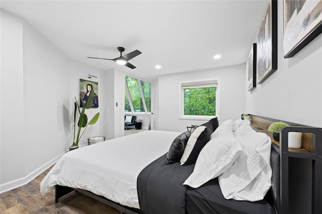 bedroom with ceiling fan and dark hardwood / wood-style flooring