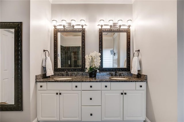 full bath featuring a sink, ornamental molding, and double vanity