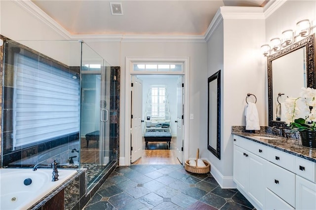 full bath featuring vanity, stone tile floors, a whirlpool tub, a shower stall, and crown molding