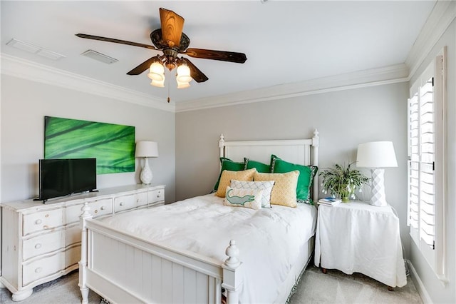 bedroom featuring a ceiling fan, crown molding, carpet, and visible vents