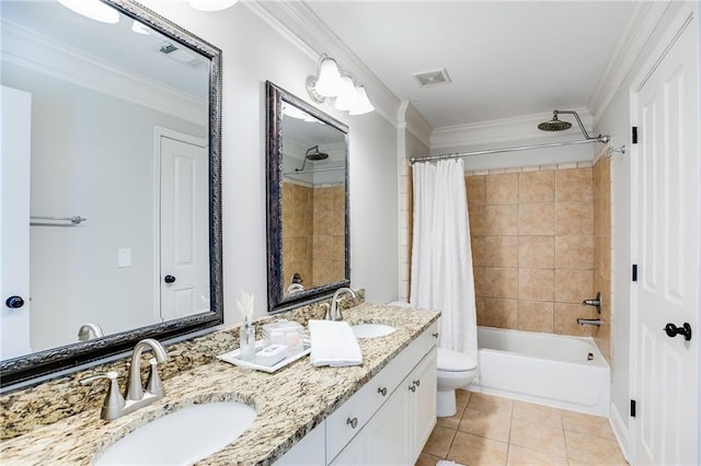 full bathroom with tile patterned floors, visible vents, crown molding, and a sink