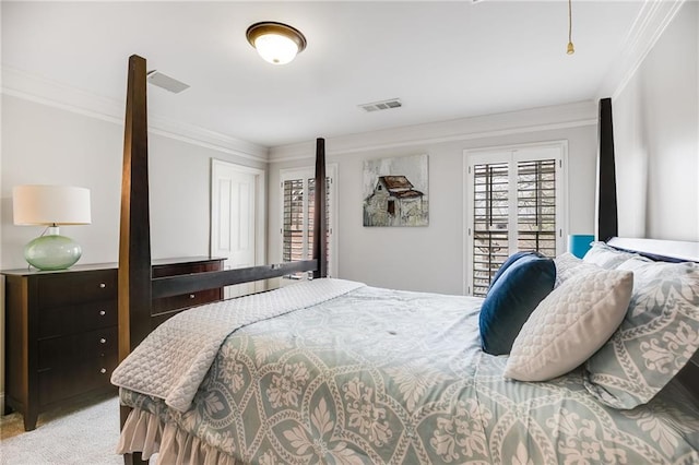 bedroom featuring light colored carpet, visible vents, and ornamental molding