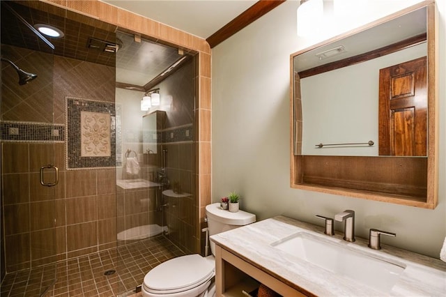 full bathroom with vanity, a shower stall, and toilet