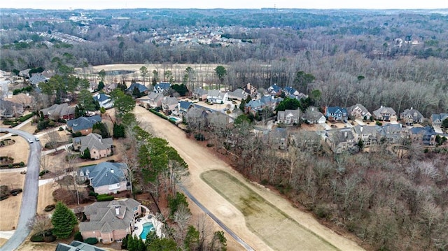 bird's eye view featuring a residential view and a forest view