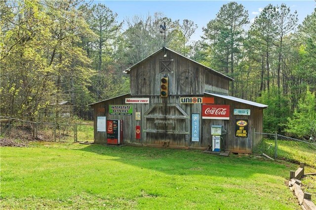 view of outbuilding with a lawn