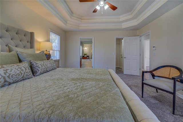 carpeted bedroom featuring ceiling fan, crown molding, and a tray ceiling