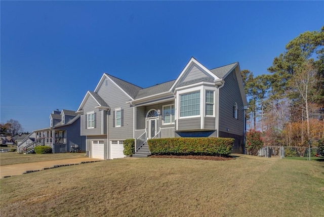 view of front of home with a front yard and a garage