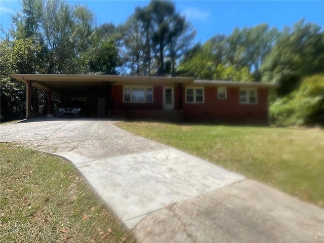 single story home with a front lawn and a carport