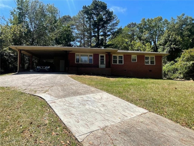 ranch-style home featuring a carport and a front yard