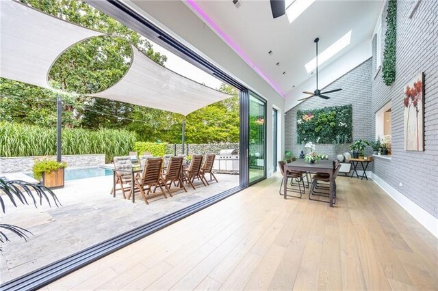 view of patio with a pool side deck and ceiling fan