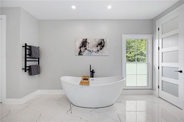 bathroom featuring vanity and independent shower and bath