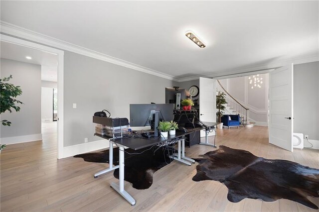 home office with hardwood / wood-style flooring and crown molding