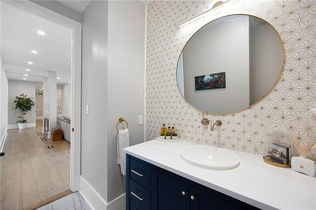 clothes washing area featuring cabinets, independent washer and dryer, ceiling fan, and sink