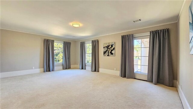 carpeted bedroom featuring crown molding