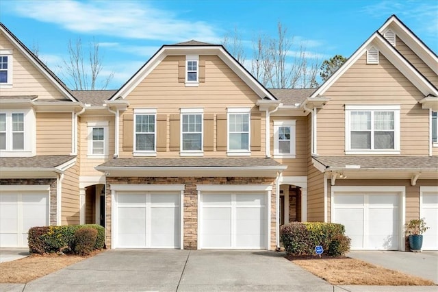 townhome / multi-family property featuring a garage