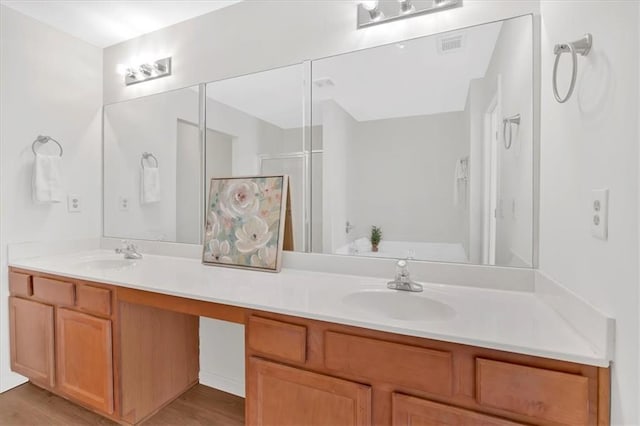 1795 Waterside Dr NW, Kennesaw, GA 30152 - bathroom with vanity, wood-type flooring, and walk in shower