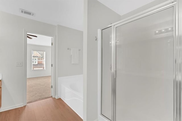 1795 Waterside Dr NW, Kennesaw, GA 30152 - bathroom with hardwood / wood-style flooring, vanity, and shower with separate bathtub