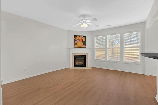 1795 Waterside Dr NW, Kennesaw, GA 30152 - unfurnished living room featuring ceiling fan and light hardwood / wood-style flooring