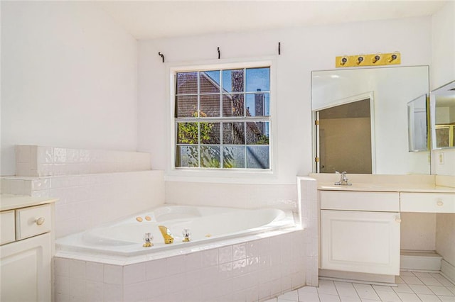 full bathroom with tile patterned flooring, a tub with jets, and vanity