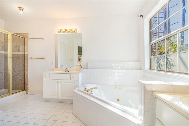 bathroom featuring a whirlpool tub, tile patterned floors, a shower stall, and vanity