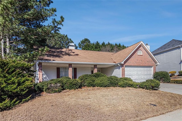 ranch-style house with driveway, brick siding, a chimney, and an attached garage