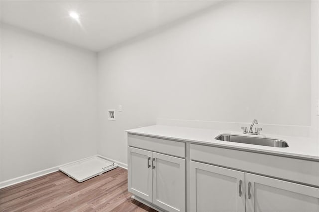 bathroom with sink and hardwood / wood-style flooring