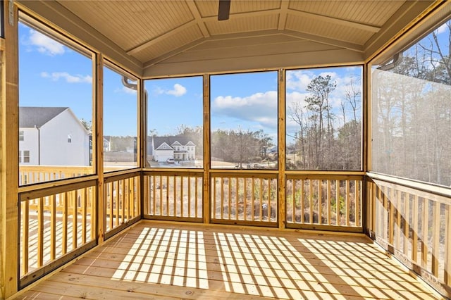 unfurnished sunroom with vaulted ceiling