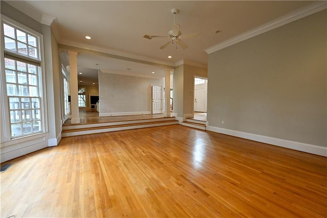 empty room featuring crown molding, light hardwood / wood-style flooring, and ceiling fan