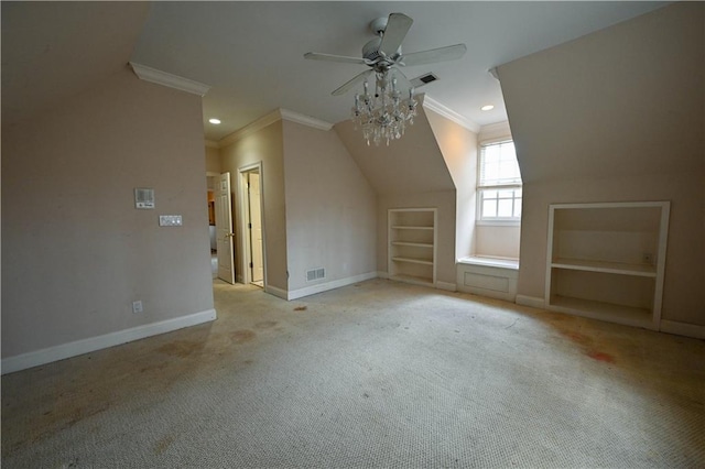additional living space featuring light carpet, built in shelves, and ceiling fan