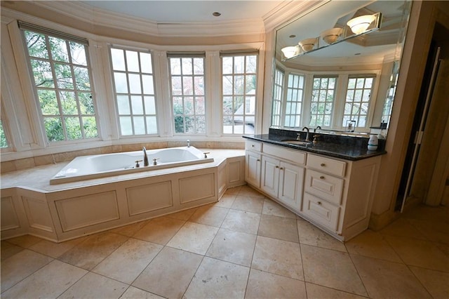 bathroom with a bath, vanity, tile patterned floors, and crown molding