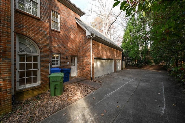 view of side of home featuring a garage