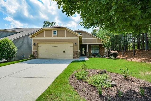 craftsman inspired home featuring a front lawn and a garage