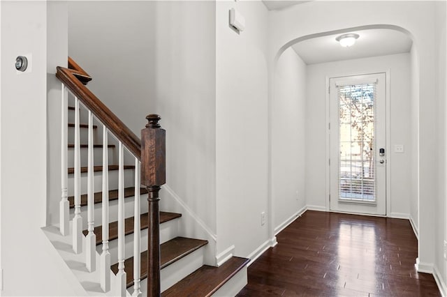 foyer with dark hardwood / wood-style floors