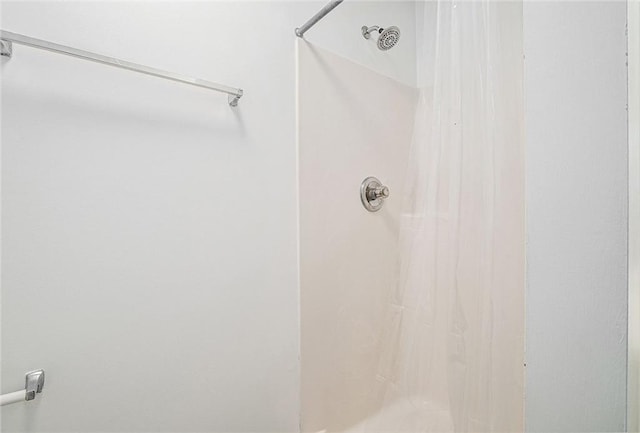 bathroom with a shower with curtain