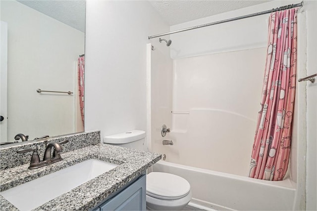 full bathroom featuring vanity, shower / tub combo, a textured ceiling, and toilet