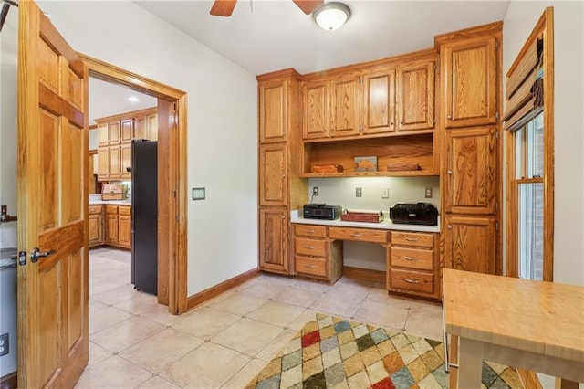 169 Robson Trl, Mcdonough, GA 30252 - office area with built in desk, ceiling fan, and light tile patterned flooring