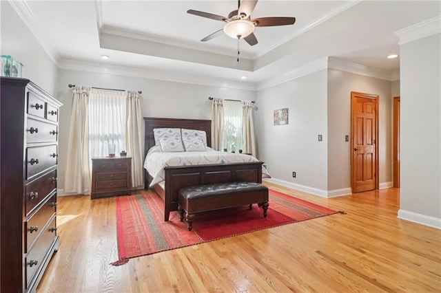 169 Robson Trl, Mcdonough, GA 30252 - bedroom with multiple windows, light wood-type flooring, a raised ceiling, recessed lighting, and crown molding