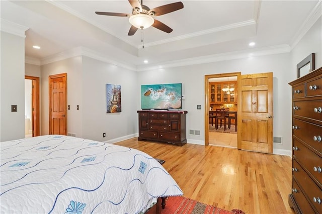 169 Robson Trl, Mcdonough, GA 30252 - bedroom featuring light wood-style flooring, recessed lighting, a raised ceiling, ornamental molding, and a chandelier