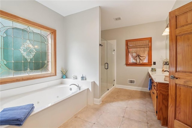 169 Robson Trl, Mcdonough, GA 30252 - bathroom with a whirlpool tub, a shower stall, vanity, and tile patterned floors