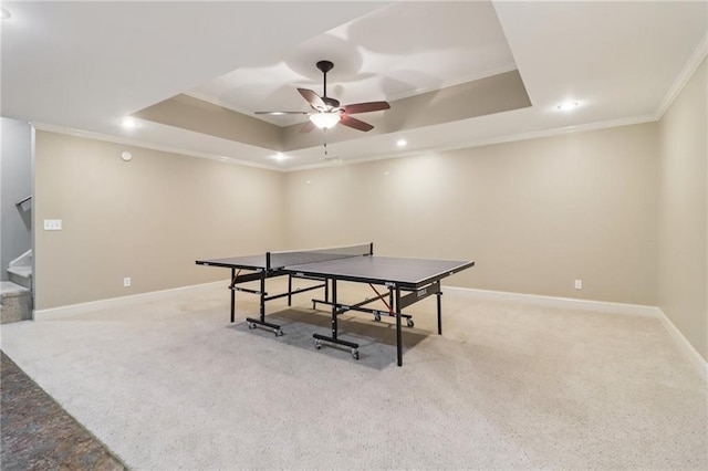 169 Robson Trl, Mcdonough, GA 30252 - recreation room featuring a tray ceiling, crown molding, a ceiling fan, light colored carpet, and recessed lighting