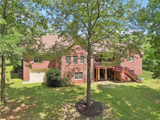 169 Robson Trl, Mcdonough, GA 30252 - rear view of house featuring stairs, brick siding, a wooden deck, a yard, and an attached garage