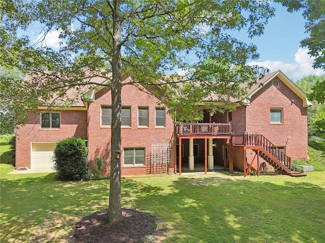 169 Robson Trl, Mcdonough, GA 30252 - back of house with brick siding, stairway, a deck, an attached garage, and a yard