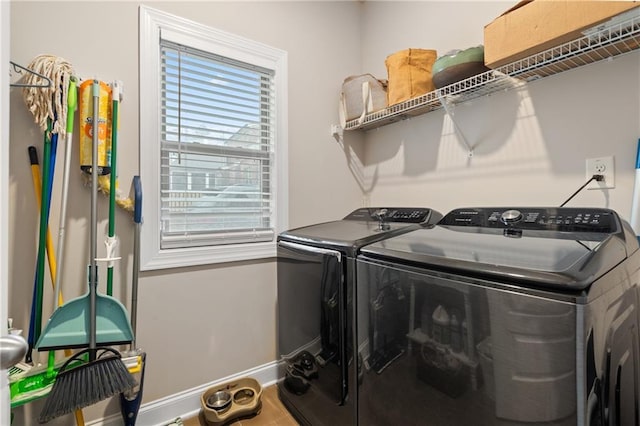 laundry area with laundry area, baseboards, and separate washer and dryer