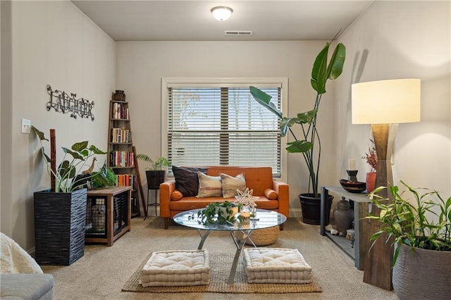 living area with carpet floors and visible vents