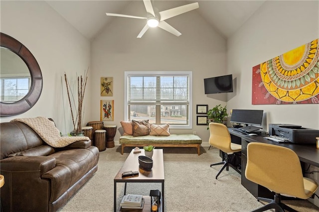 office space featuring a ceiling fan, carpet flooring, and high vaulted ceiling