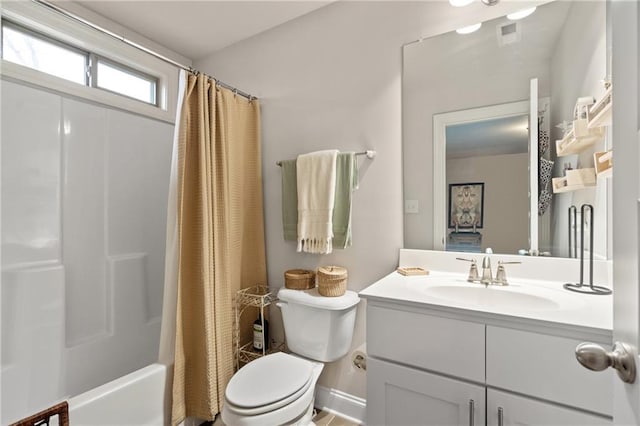 full bathroom with vanity, shower / bath combo with shower curtain, toilet, and baseboards