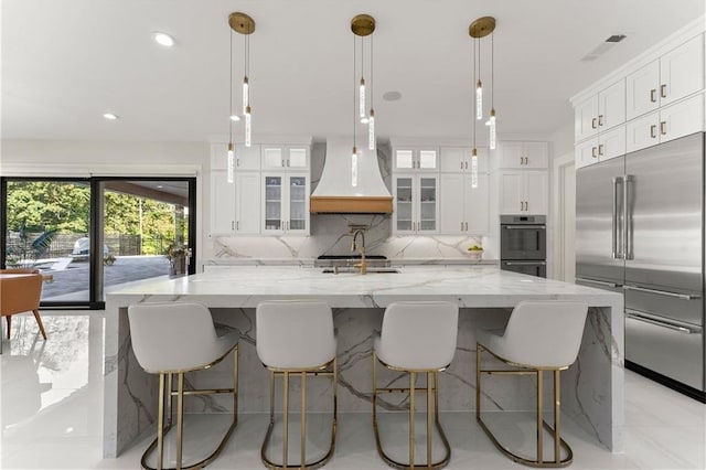 1336 Azalea Dr, Lawrenceville, GA 30043 - kitchen with appliances with stainless steel finishes, tasteful backsplash, a large island, white cabinets, and a sink
